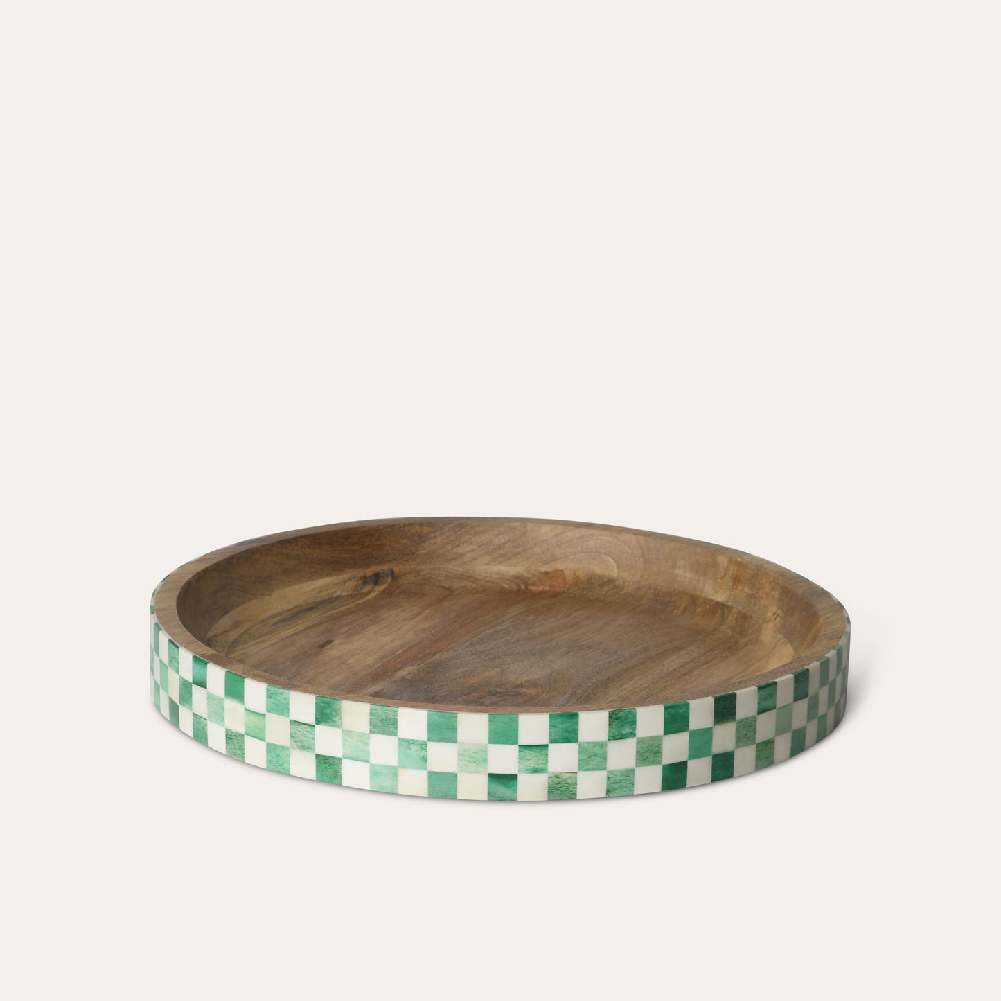 Wooden tray with a green and white checkered edge on a beige background