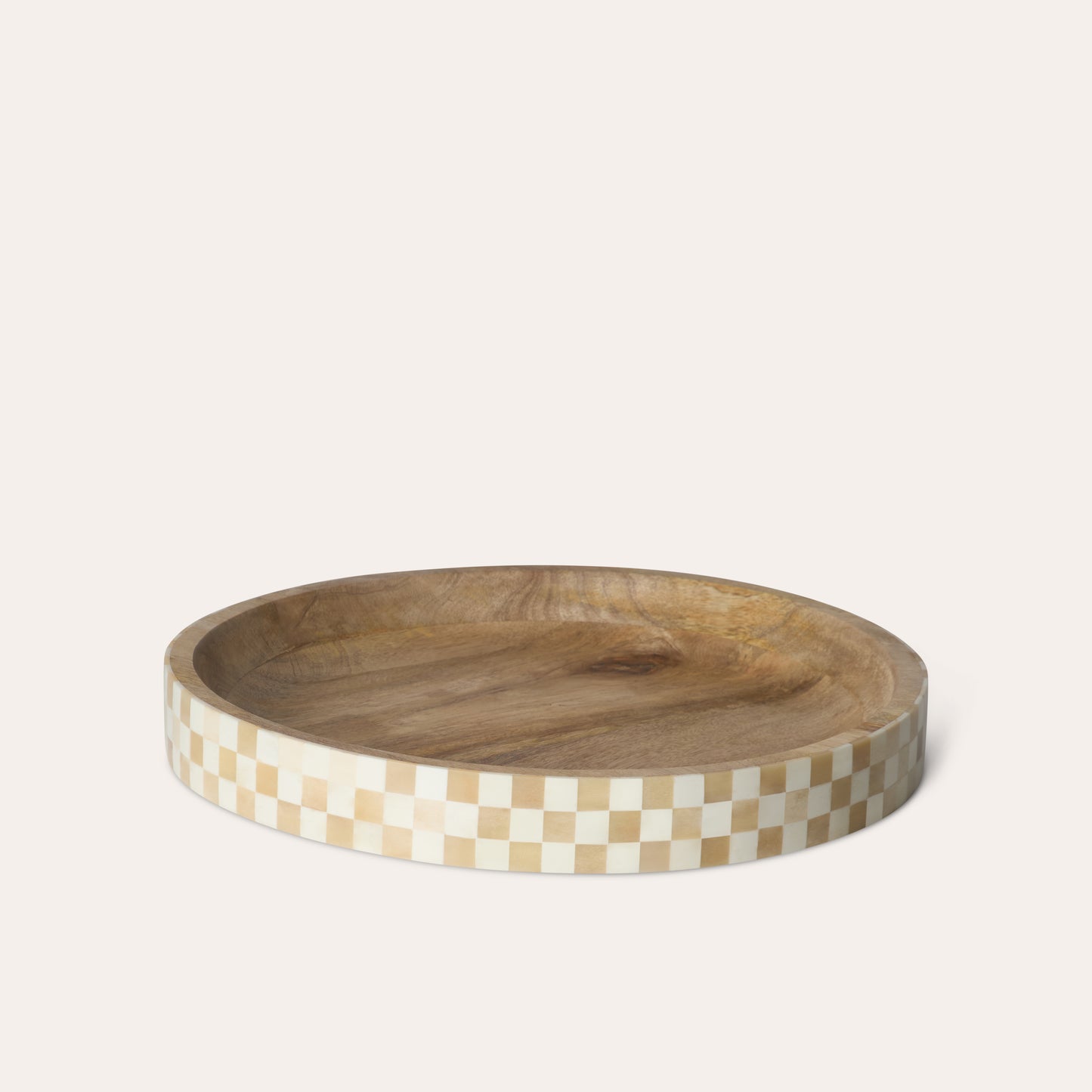 Circle round wooden tray with a beige and white checkered border on a white background.