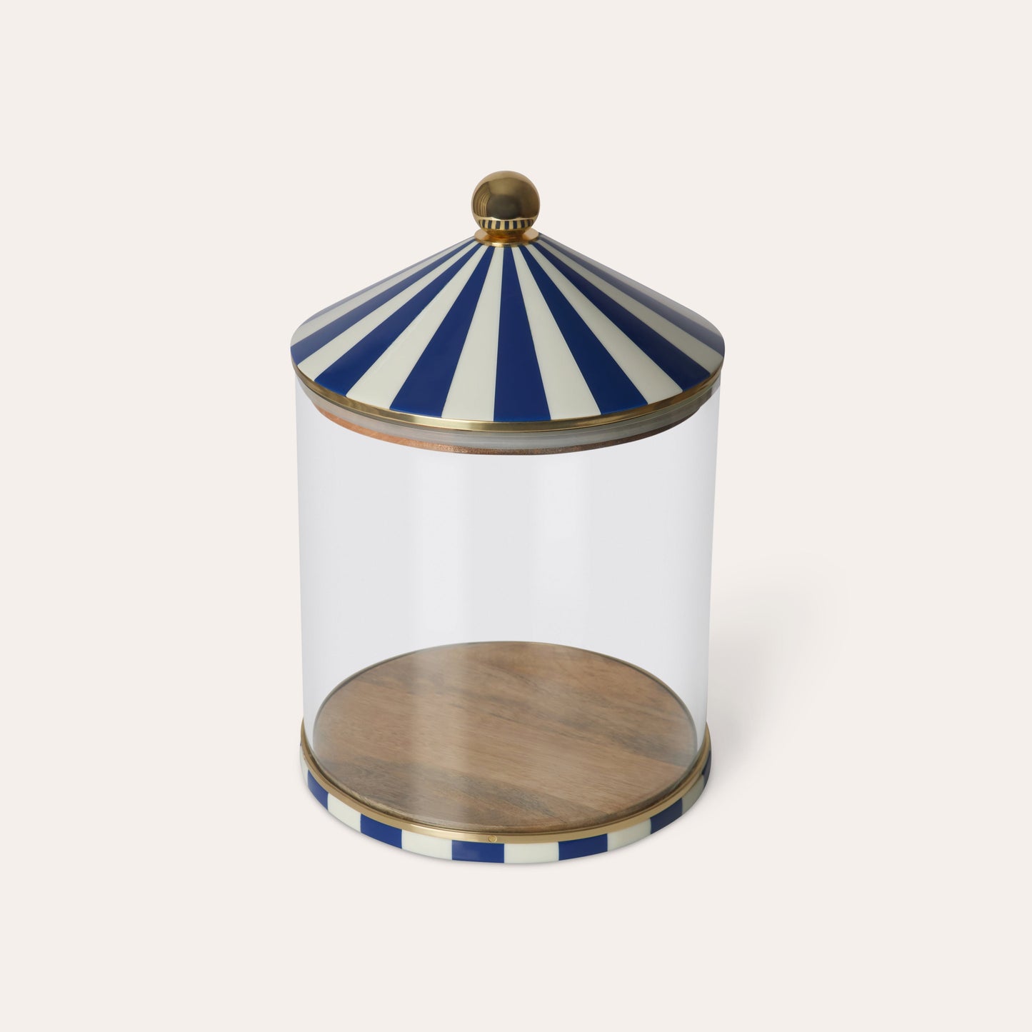Clear glass jar with a blue and white striped lid on a white background