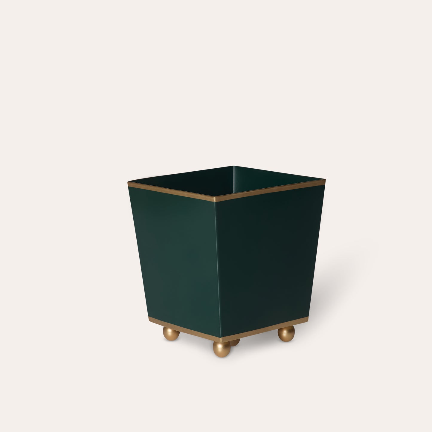 Green rectangular planter with gold accents on a light beige background
