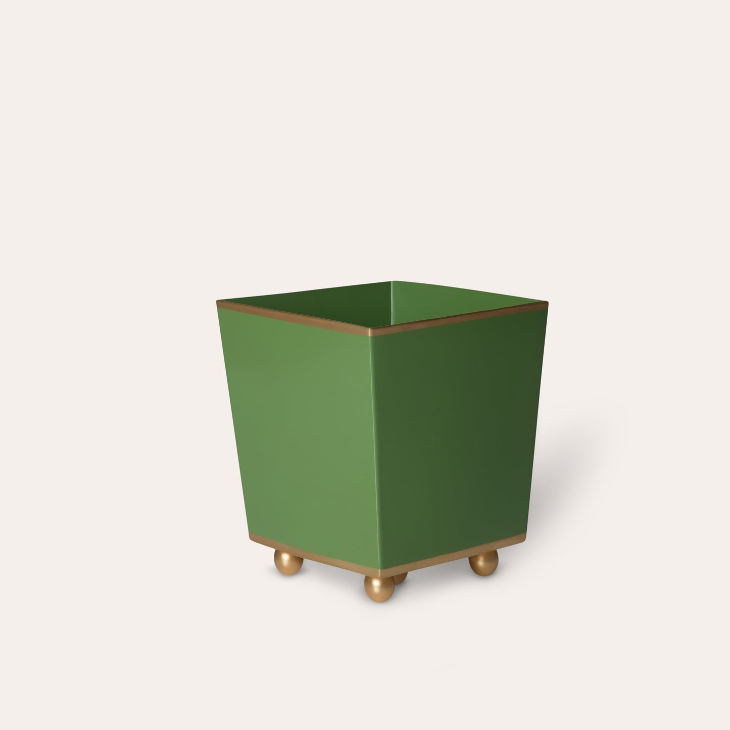 Green square planter with gold feet on a white background