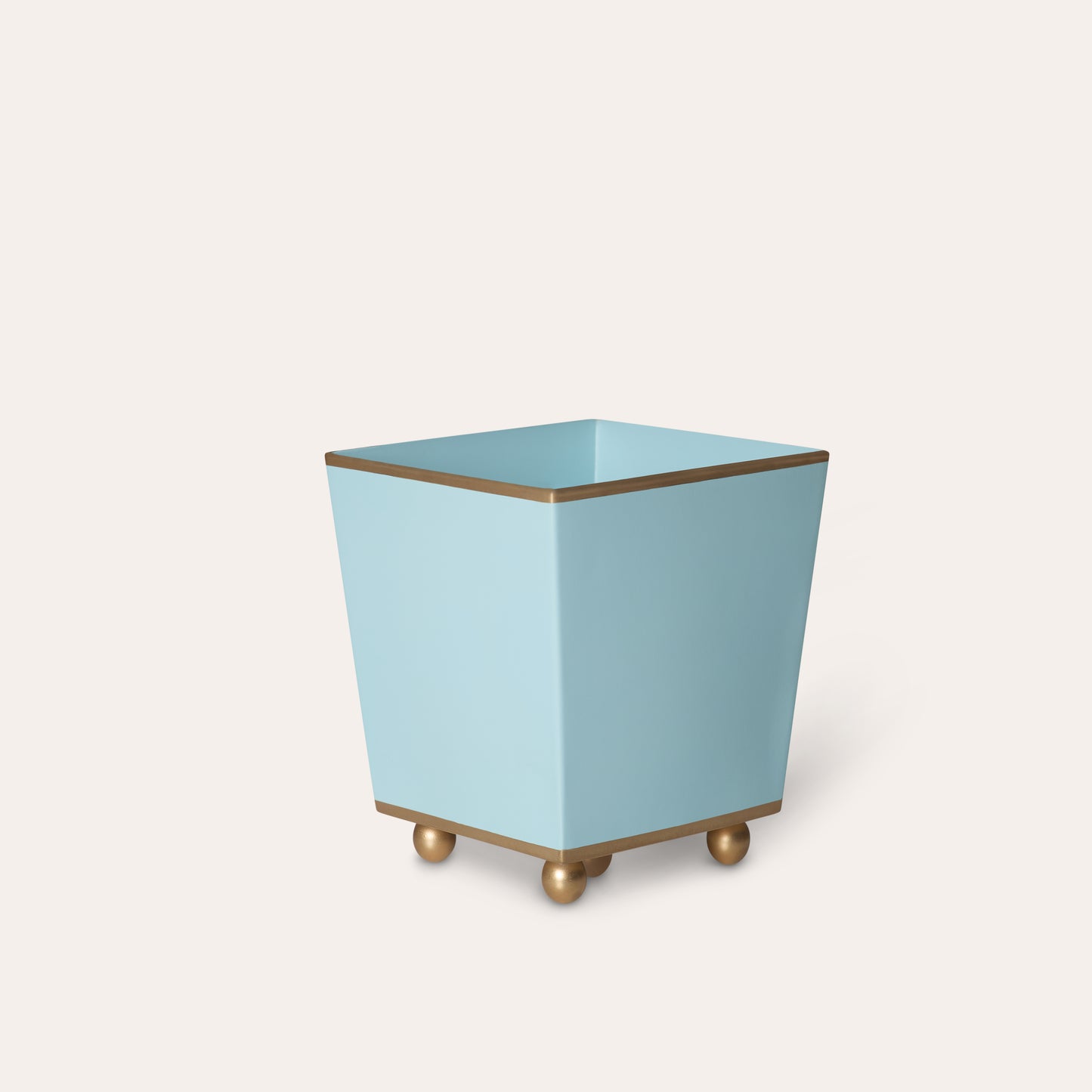 Light blue plant pot with gold accents on a white background.