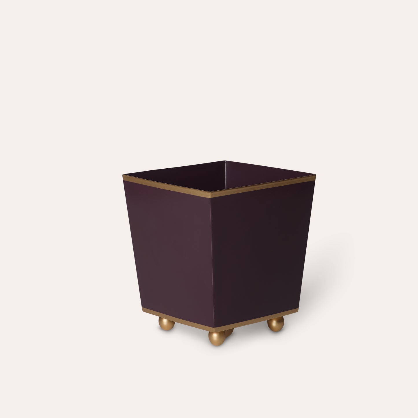 Square purple planter with gold accents on a white background