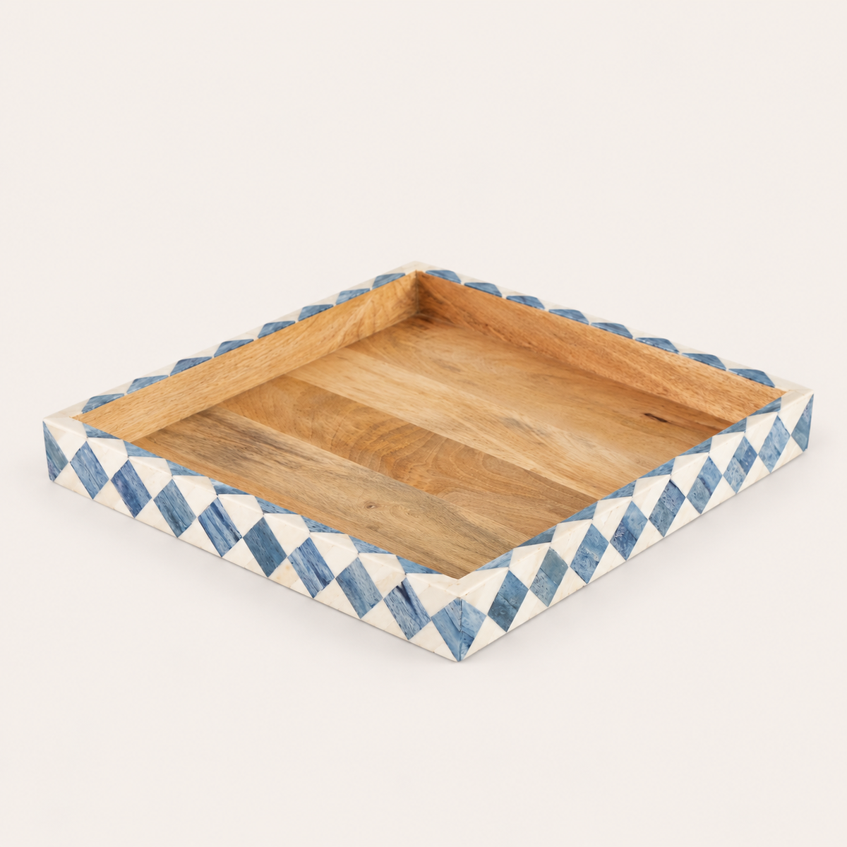 A square wooden serving tray with a scalloped edge, featuring a natural wood interior and a white border decorated with blue and white inlaid geometric patterns, shown on a light beige background.
