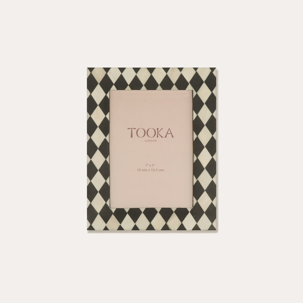 Checkered photo frame with 'Tooka' branding on a white background