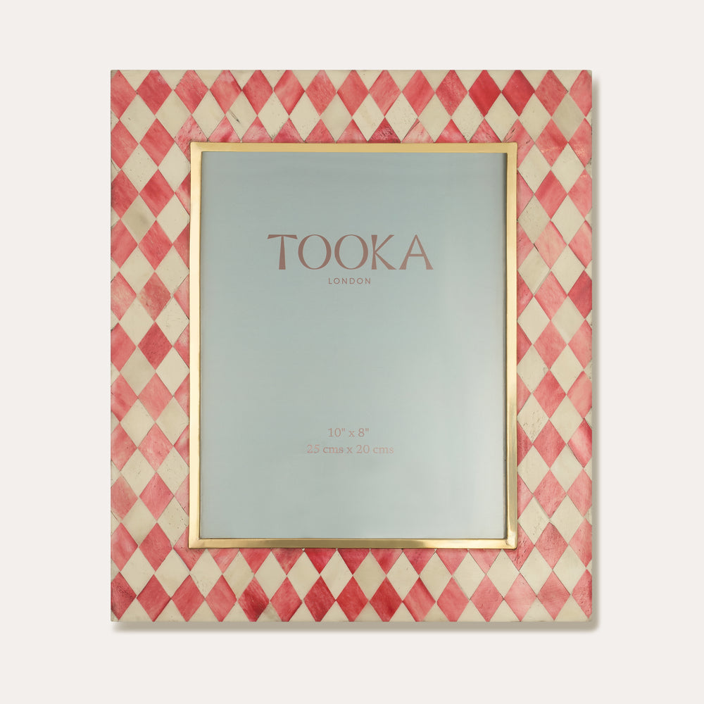 Decorative picture frame with red and beige checkered pattern on the diagonal and 'Tooka' branding.